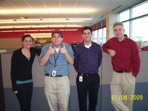 Here are my coworkers and I (I believe all UC grads) with the Virginia Tech hat.  I'm making the "thumbs up"